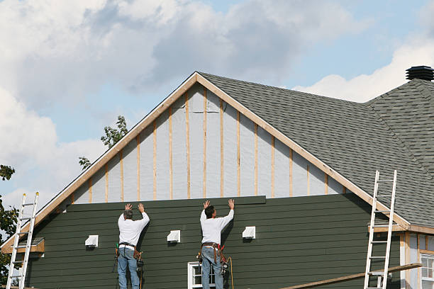 Professional Siding Repair technician working in Wheaton, MD